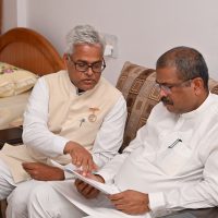 Rajyogi Suryamani Bhaiji Explainging the Divyang seva Report to Union Minister Mr Dharmandra Pradhan